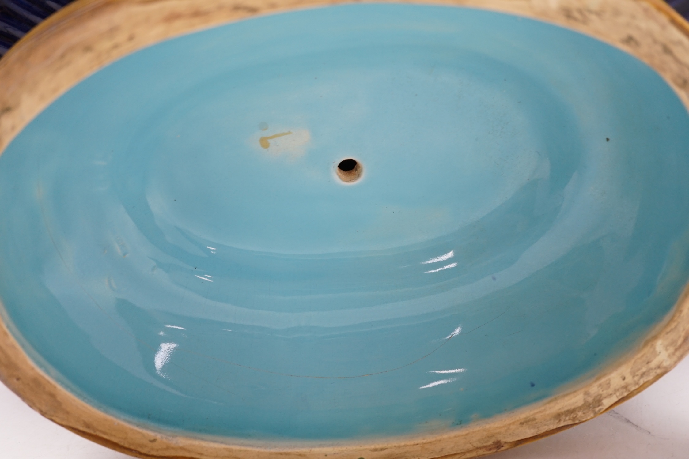 A Minton majolica cheese dome, and a large majolica pedestal tureen, 42cm wide. Condition - fair